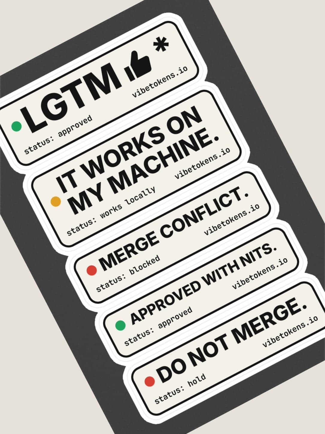 Code Review Sticker Sheet at an angle, showing the white kiss-cut border around each badge. Fourthwall mockup.